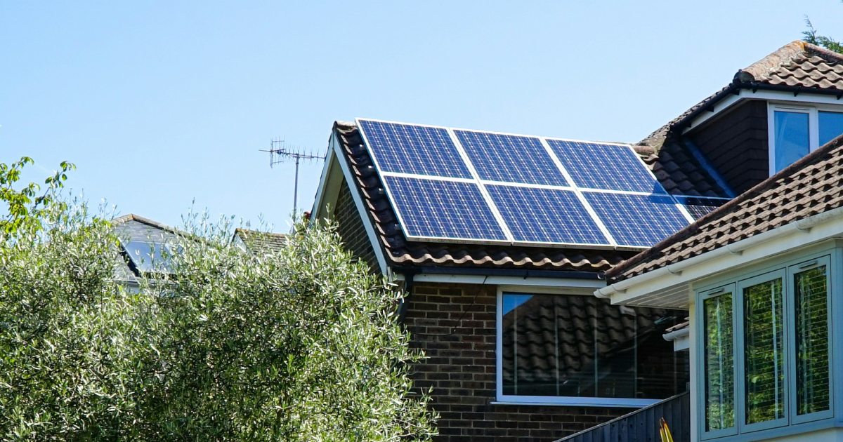 pitch roof house with solar panels